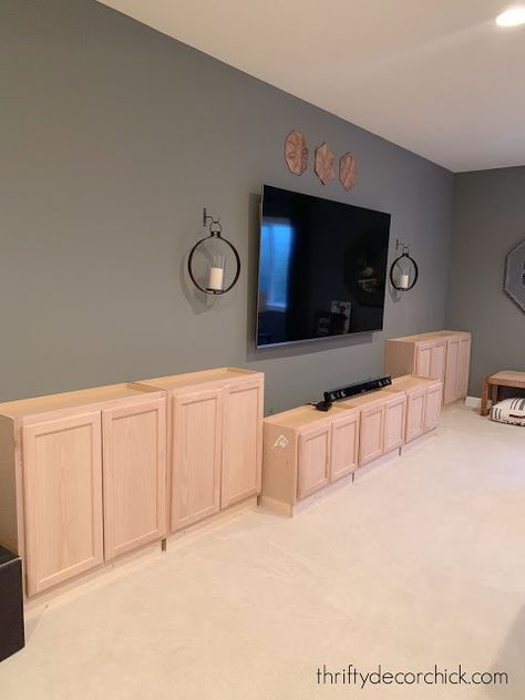 Diy Cheap Built Ins, Wall To Wall Tv Unit, Unfinished Cabinets Entertainment Center, Basement Tv Built In Wall Units, Basement With Half Wall Ledge, Rustic Wall For Tv, Diy Built In Entertainment Center Plans, Living Room Tv Entertainment Center, Diy Entertainment Wall With Fireplace