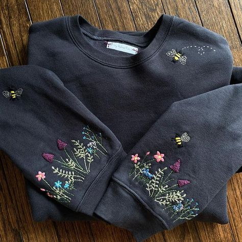 Art by AubreeRen | Some closeups of my latest wildflower sleeve sweatshirt with bees! I used a metallic thread for the wings and love how it turned out. •🪡 … | Instagram Wildflower Sleeve, Embroidered Sweatshirt Diy, Embroidery Plants, Christmas Sweatshirt Ideas, Sweater Embroidery, Clothes Embroidery Diy, Fancy Shirt, Diy Embroidery Designs, Diy Clothes And Shoes