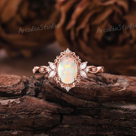 Unique Opal Engagement Ring Rose Gold Ring Nature Inspired Ring Leaf Floral Ring Vintage Moissanite Ring Art Deco Promise Rings for Women If you want to see more pictures of other gemstone rings, you can click on the links below. Moissanite: https://www.etsy.com/listing/1558807664 Alexandrite: https://www.etsy.com/listing/1585914484 RING INFORMATION ★ Engagement ring ⊹Center Stone - Natural Opal    Cut - Oval shaped    Size - 5x7mm       ⊹Side Stone - Moissanite /Natural Diamonds    Weight: About 0.212ct    Cut - Marquise & Round shaped    Clarity - SI-VS    Color- G-H ⊹Band width - 1.5mm ⊹Metal - 14k or 18k solid gold (available in yellow, white or rose gold) ⊹Ring size - any sizes (size above 9 will be priced individually) Enter my shop: www.etsy.com/shop/ArcadiastudioUS MAKING & SHIPPIN Fairytale Engagement Rings, Opal Engagement Ring Rose Gold, Fire Opal Engagement Ring, Vintage Opal Engagement Ring, Unique Opal, Opal Engagement Ring, Cute Engagement Rings, Future Engagement Rings, Nature Inspired Rings