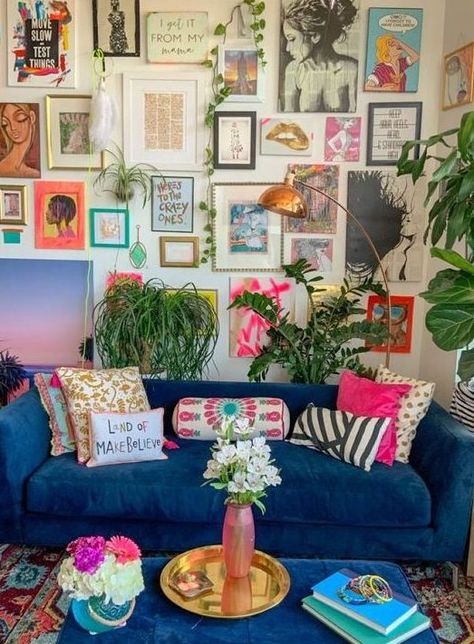 a maximalist living room with neutral walls, a blue sofa and a matching ottoman, a colorful gallery wall and lots of potted plants Maximalist Living Room, Funky Living Rooms, Blue Couch, Maximalist Interior, Colorful Apartment, Apartment Decoration, Funky Home Decor, Colourful Living Room, Have Inspiration