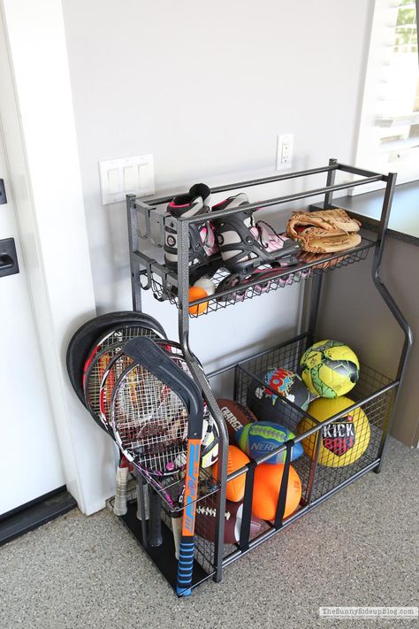 Sport Garage Organization, Store Sports Equipment, Storage For Sports Equipment, Garage Storage For Sports Equipment, How To Organize Sports Equipment, Sports Rack Storage Ideas, Garage Baseball Organization, Sports Ball Storage Garage Organization, Organizing Sports Equipment