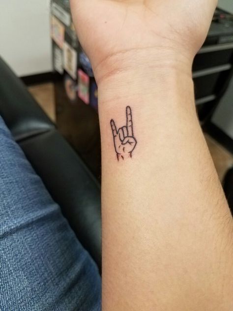 Rock Hand Symbol Tattoo, 2023 Tattoo Trends Men, Rock And Roll Hand Sign Tattoo, Rock And Roll Hand Tattoo, Rock Music Inspired Tattoos, Metal Music Tattoo Ideas, Metal Tattoos For Guys, Rocker Hand Tattoo, Rock N Roll Hand Tattoo