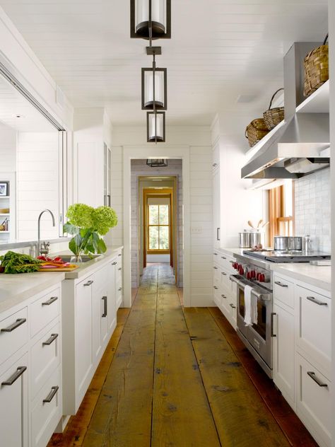 Designed for a fun young family, this Maury Island waterfront vacation home embodies the essence of tradition. The comfortable… Galley Kitchen Cabinets, Small French Country Kitchen, White Galley Kitchens, Galley Kitchen Renovation, Galley Kitchen Remodel Ideas, Kitchen Galley, Small Galley Kitchen, Small Galley Kitchens, Galley Kitchen Design