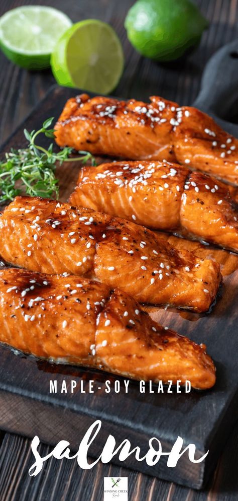 Four fillets of baked salmon served with a glaze of maple-soy and topped with a sprinkle of sesame seeds, with sliced lime in the background. Maple Soy Glazed Salmon, Candied Salmon Recipe, Maple Soy Salmon, Salmon Sauce Recipes, Maple Salmon Recipes, Soy Glazed Salmon, Salmon Recipes Oven, Salmon Bites Recipe, Oven Salmon