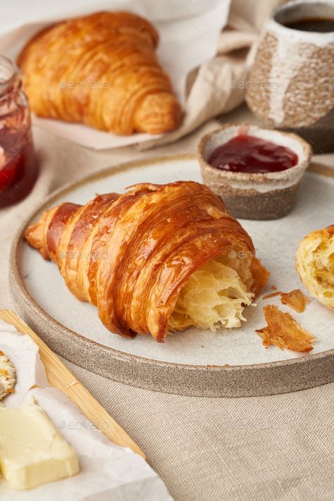 Two delicious croissants on plate and hot drink in mug, side view, vertical by Natabuena. Two delicious croissants on plate and hot drink in mug. Morning French breakfast with fresh pastries and jam. Light g... #Sponsored #mug, #drink, #view, #side Croissant With Jam, Croissant Photography, Morning Pastries, Breakfast Croissant, Fresh Pastries, French Croissant, Fruit Pastries, Breakfast Photography, Croissant Breakfast