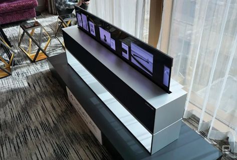 LG's rollable OLED R TV costs $100,000 in the US LG is done skirting around the price of its rollable OLED R TV. As noted by The Verge, the company’s US website now says you can buy the set for $100,000. Previously, not only did LG not list the price of the OLED R in the US, you had to call a sales representative to buy one. Now all that’s in between you and the company's futuristic TV is an “Add to Cart” button and about the cost of a down payment on a house in the Bay Area. For that amo... Tv 65 Inch Living Room, Rollable Tv, Lg Display, Hidden Tv, Lg Tv, Lg Oled, Home Theater Setup, Oled Tv, Audio Room