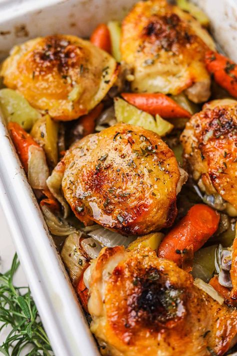 Roasted Chicken Thighs and Vegetables is an easy, hearty one-pan dinner recipe that results in crispy, juicy chicken and flavorful vegetables. Just toss the chicken, potatoes, onions, and carrots in mustard, honey, and olive oil, season, then roast in the oven until golden! Roasted Chicken Thighs And Vegetables, Roast Chicken Thigh Recipes, Chicken Thighs In Oven, Oven Roasted Chicken Thighs, Chicken Thighs Dinner, Potatoes Onions, Hearty Dinner Recipes, Roasted Chicken Thighs, Flavorful Vegetables