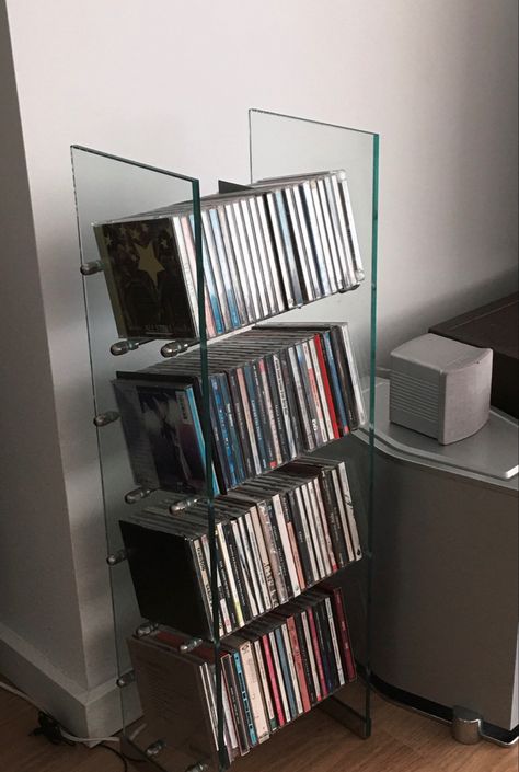 Creative Cd Storage, Icarly Room Aesthetic, Dvd Astethic, Movie Shelf Aesthetic, Cds Wall Decor, Ways To Display Cds, Cd Shelf Aesthetic, How To Display Cds, Cd Player Set Up