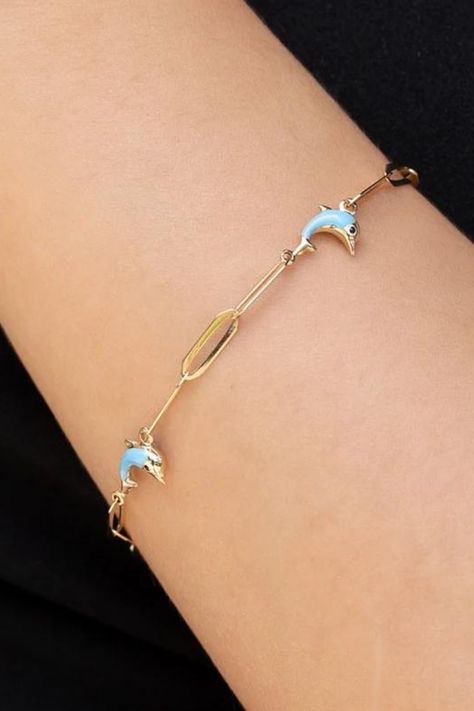 There are four dolphin charms on this paperclip chain. Blue enamel on these charms makes the bracelet unique. Lover Bracelet, Dolphin Bracelet, Blue Dolphin, Gold Certificate, Lovers Bracelet, Sea Lover, Ocean Colors, Bracelet Dainty, Dainty Bracelet