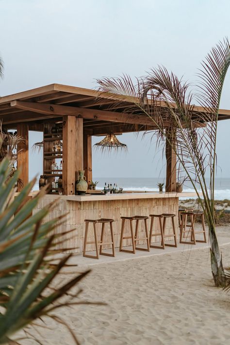 A beach bar is among the seaside guest facilities. Beach Restaurant Design, Seaside Hotel, Mexico Hotels, Beach Cafe, Rooftop Patio, Hotel Building, Beach Bar, Pool Bar, Beach Bars