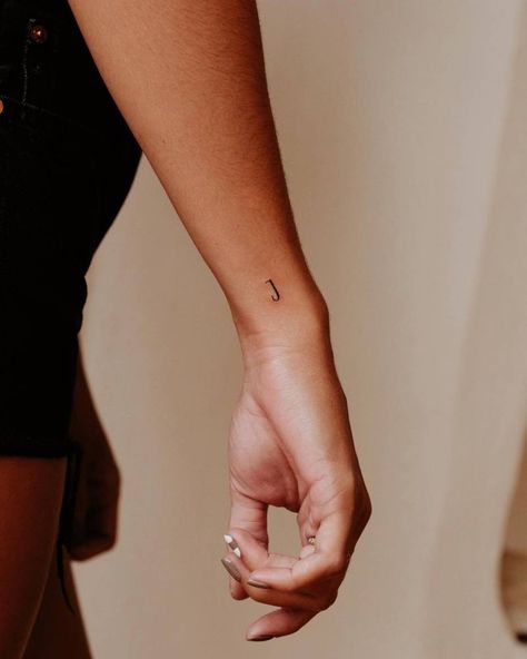 Minimalistic letter "J" tattoo done on the wrist. Sons Initial Tattoo, Minimalist Tattoo Initials, Dainty M Tattoo, Letter Placement Tattoo, Fine Line J Tattoo, Initial Fine Line Tattoo, Small Tattoo For Son, Dainty Date Tattoos, Fine Line Tattoo Initials