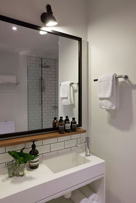 Small wood shelf under mirror. HASSELL | Projects - Ovolo Laneways Bathroom Mirror Design, Bathroom Mirror With Shelf, Bilik Air, Bathroom Mirror Frame, Bathroom Model, Gorgeous Bathroom, Mirror With Shelf, Trendy Bathroom, Large Bathrooms