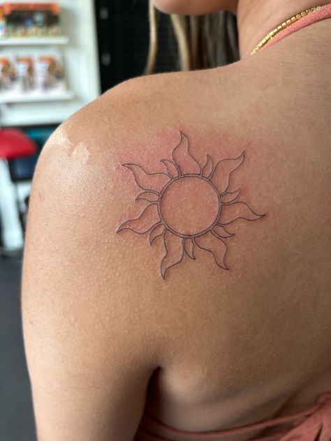 Sun In Rapunzel, Rapunzels Flower Tattoo, Repunzal Tattoo Ideas, Rapenzul Tattoo, Yellow Word Tattoo, Rapunzel Tangled Tattoo, Rapunzel Aesthetic Tattoo, Flower From Rapunzel Tattoo, You Were My New Dream Tangled Tattoo