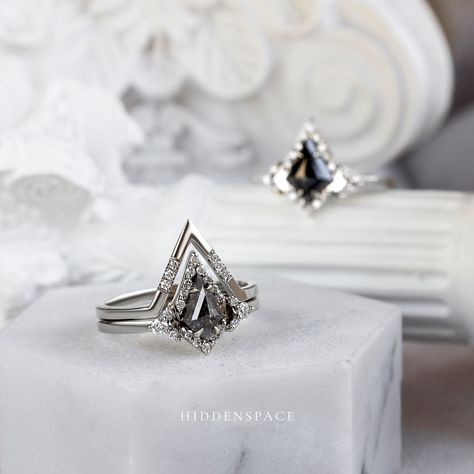 You've seen halo rings, but kite halo rings with negative spaces offer minimal elegance and a phenomenal look when paired with a band that sits perfectly atop. 𝐃𝐞𝐬𝐢𝐠𝐧𝐞𝐝 𝐟𝐨𝐫 𝐭𝐡𝐞 𝐌𝐨𝐝𝐞𝐫𝐧 𝐌𝐮𝐬𝐞 #hiddenspacejewelry #kiteshapering #saltandpepperdiamondring #uniqueengagementring #platinumring #whitegoldring #designerjewelry #finejewelry #blackdiamond #blackaesthetic #internationalpicnicday #picnicday Unique Makeup, Modern Muse, Pepper Diamond, Modern Art Deco, Platinum Ring, Salt And Pepper Diamond, Halo Rings, Unique Engagement Rings, Black Aesthetic