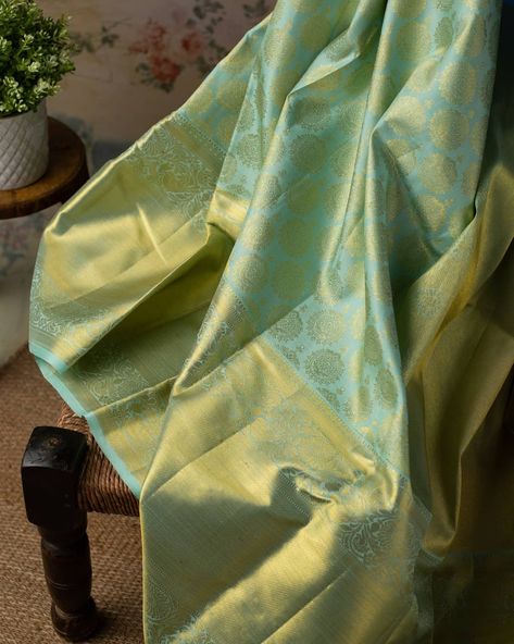 Like sunbeams sparkling on a serene realm, intricately crafted gold zari chakras brocade twinkle merrily on this Pastel Green Kanchipuram Silk Tissue Saree. The rich self zari temple border with brocade and floral vines nestling birds is a fabulous complement.    . . . . #Kanchipuramsilk #Kanchisilk #Silksaree #Silk #SOTD #OOTD #Kankatala Kanchipuram Silk Saree Aesthetic, Pastel Green Kanchipuram Saree, Pastel Colour Silk Saree, Pastel Green Silk Saree, Manavarai Saree, Green Kanchipuram Saree, Graduation Saree, Pastel Green Saree, Bread Wedding