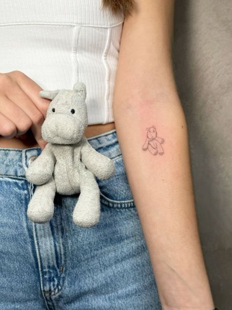 Elephant Stuffed Animal Tattoo, Small Subtle Disney Tattoos, Small Detailed Tattoos Unique, Tiny Upper Arm Tattoo, Animal Tattoo Placement, Pillow Pet Tattoo, Childhood Bear Tattoo, Lamb Stuffed Animal Tattoo, Stuffed Animal Tattoo Simple