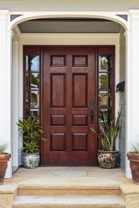 Flagstone entry stairs lead to this dark wood front door that's flanked by mirrored side panels. It is accented with a pair of hand painted ceramic pots. Wooden Main Door, Door Colors, Front Door Ideas, Wooden Front Doors, Wood Front Doors, Entrance Door Design, Wooden Door Design, House Front Door, Main Door Design