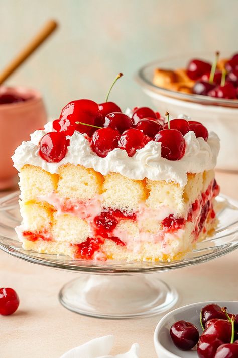 Heaven on Earth Cake is a delightfully simple layered dessert crafted with ready-made ingredients. It features layers of fluffy angel food cake, sweet cherry pie filling, smooth vanilla pudding, and airy whipped topping, all finished with a sprinkle of sliced almonds. Utilizing canned cherry pie filling offers a tasty shortcut for this dessert. Explore other White Cake With Cherry Pie Filling, Slice Of Heaven Cake Recipe, Angel Food Cake Toppings, Heaven Cake Recipe, Canned Cherry Pie Filling, Canned Cherry Pie, Heaven On Earth Cake, Berry Pie Filling, Heaven Cake