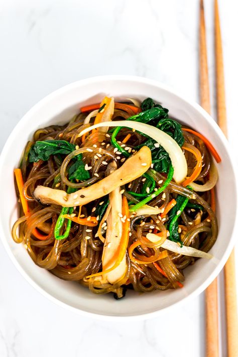 Vegan Japchae (Korean glass noodles) recipe - This is my mom's authentic Japchae recipe made into a vegan-friendly version! Sweet and savory noodles with different vegetables to create a perfect dish that everyone will love! Savory Noodles, Japchae Recipe Korean, Potato Starch Noodles, Korean Vegetarian, Stir Fry Glass Noodles, Glass Noodles Recipe, Korean Glass Noodles, Yummy Vegetables, Asian Vegetarian Recipes