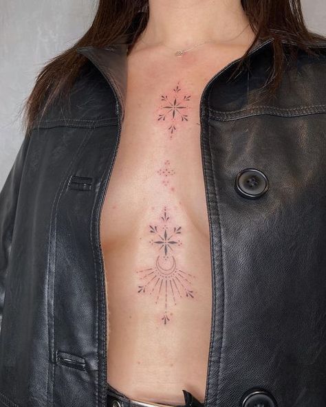 Emily ☾ Celestial Tattooist on Instagram: "Sternum and chest embellishments for the loveliest lady 💫✨ . . . . #finelinetattoo #fineline #sternumtattoo #ornamental #ornamentaltattoo #moontattoo #celestialtattoo #leeds #hydeparkleeds #tattooleeds #leedstattoo #delicatetattoo #femininetattoo #smalltattoo #tinytattoo" Celestial Stomach Tattoos, Sparkle Tattoo Sternum, Decorative Chest Tattoo, Sternum Sparkle Tattoo, Ornamental Tattoo Chest Women, Chest Sternum Tattoo Female, Sparkle Tattoo Chest, Celestial Ornamental Tattoo, Sparkle Chest Tattoo