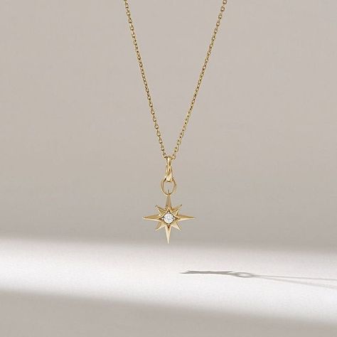 This exquisite 14k solid gold necklace features a captivating North Star pendant, adorned with a sparkling diamond at its center. The star's design, with its eight graceful points, evokes the celestial beauty of the night sky. It's a truly unique and meaningful piece that will make a lasting impression. North Star Pendant, Gold Star Pendant, North Star Necklace, Solid Gold Necklace, Necklace Collection, Pendant For Women, Luxury Necklace, Sparkling Diamond, Necklace Unique