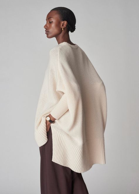 Wrap yourself in the luxurious softness with our poncho style sweater. Combining the sophistication of cashmere with a modern, relaxed silhouette. The fitted sleeves make it easy easy to move around in. Ribbed neck hem. Details 100% Cashmere Ivory 7701LNC-F24 Relaxed fit Model is 5'9" and wears a size small. Dreamy Fashion, Instagram Editor, Batwing Sweater, All White Outfit, Fitted Sleeves, Poncho Style, Cashmere Jumper, Color Crush, Style Sweater