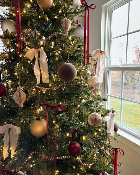 Sharing some holiday decor inspo of our Christmas tree last year! Cannot wait to decorate for the holidays this year! Save and follow along for more holiday decor ideas.🎄❤️ Comment “holiday” and I’ll send link directly to your DM to shop! #christmas #christmastree #christmastreedecor #holidaydecor #holidayinspo #ornaments #christmasornaments #holidayornaments #christmasdecor #mcgeeandco #kingofchristmas Brown Red And Green Christmas Tree, Little Red Bows On Christmas Tree, Boho Red Christmas Tree, Garlands For Christmas Trees, Neutral Christmas Tree Pops Of Red, Christmas Time Ideas, Dainty Christmas Tree, Nancy Meyers Christmas Tree, Traditional Tree Decorations