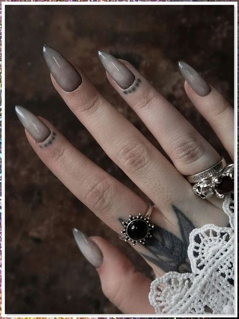 If you're looking for a way to add a little edge to your look, Goth stiletto nails are perfect! These nails are designed with a long, thin blade on one end and a pointy, black stiletto on the other. They are perfect for a Goth look and can be paired with a black dress or clothing to create the perfect look. Dark October Nails, Grey Gothic Nails, Vampire Ombre Nails, Vampire Nails Gothic Aesthetic, Grey Goth Nails, Simple Witchy Nail Designs, Nail Art Gothic Dark Beauty, Nail Gothic Ideas, Easy Goth Nail Art