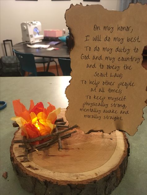 Eagle Scout centerpiece Cricut Eagle Scout, Eagle Award Ceremony, Eagle Scout Desserts, Eagle Scout Celebration Ideas, Fire Centerpiece Ideas, Cub Scout Recruitment Table, Eagle Ceremony Ideas, Eagle Scout Party Ideas, Eagle Scout Ceremony Ideas