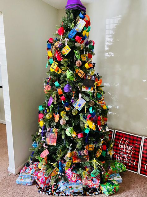 Preschool Christmas Tree Decorations, School Themed Christmas Tree, Storybook Christmas Tree, Crayon Christmas Tree, Crayola Christmas Tree, Kids Theme Christmas Tree, Kid Christmas Tree Themes, Art Themed Christmas Tree, Classroom Christmas Tree Ideas