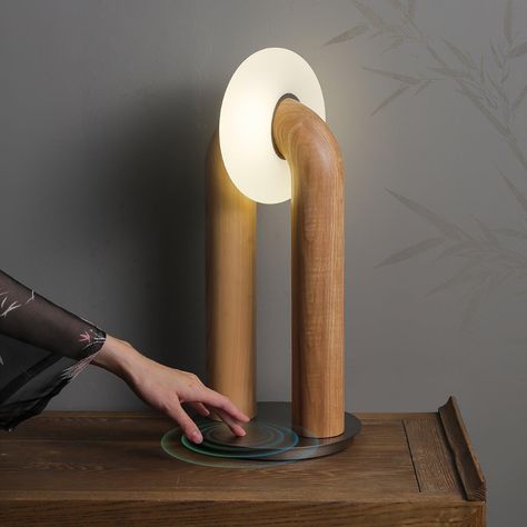 This U-Shaped Xuanguang Table Lamp is both beautiful and practical. It features a Tianmen Xuanguang, an acrylic lampshade, a metal base to enhance load-bearing capacity, and a solid wood lamp body with whole wood carving natural texture. It has a touch switch for easy use and an optical light guide for a soft and natural glow. An excellent combination of form and function. 
 If you have any questions about our products, please contact us and we will get back to you within 24 hours. 
 Original design of the same series of solid wood products, click to learn more>>> 
   Product Size 
 Size: Dia 20cm x   H 45cm /  7.9 x H 17.7 
 
 Details 
 Material:  Wood, Acrylic, Metal. 
 Light source: Integrated LED (LED lights are fully built into the fixture and cannot be replaced). 
 Kelvin range: Warm Beautiful Product Design, Metallic Table, Metal Lamp Base, Arch Light, Arch Lamp, Wood Lamp Design, Hallway Wall Lights, Tiffany Style Table Lamps, Oak Plywood