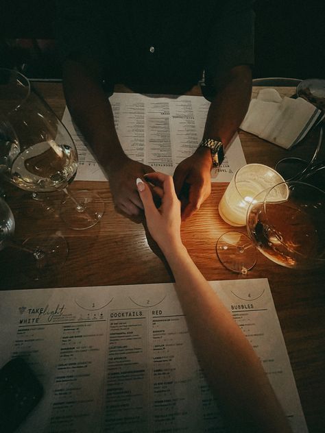 a low lit dinner, a woman’s hand is being held by a partner . Wine glasses are all around and menus sitting on a wooden table. Room Creative Ideas, Lowkey Relationship Pictures, Best Living Room Ideas, Living Rooms Ideas, Soft Launch, Modern Living Room Decor, Vision Board Images, Best Living Room, Vision Board Photos