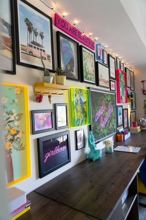 Maximalism at its finest. This gallery wall features bright and fun artwork that is framed with neon acrylic frames with solid black mixed in, creating a fun and creative wall. Colorful Art Gallery Wall, Vintage Living Room Wall Color, Maximalist Makeup Room, Modern Maximalist Decor Office, Maximalist Photo Wall, Random Gallery Wall, Neon Gallery Wall, Colorful Gallery Wall Living Room, Diy Maximalist Wall Art