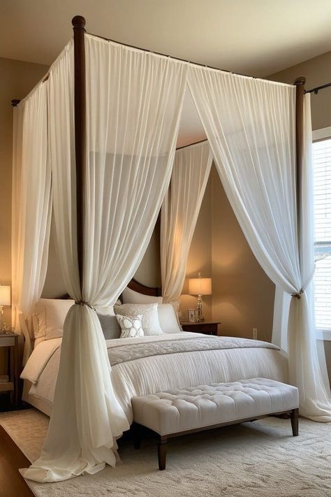 Canopy beds have long been associated with luxury and romance. These stunning centerpieces can instantly elevate your bedroom's ambiance and create a cozy, intimate space. Here are 15 inspiring canopy bed ideas to help you design the bedroom of your dreams. Small Room Big Bed, Butterfly Organization, Victorian Inspired Bedroom, Modern Canopy Bed, Wooden Canopy Bed, Wood Canopy Bed, Luxury Bedrooms, Canopy Bed Frame, Earthy Bedroom