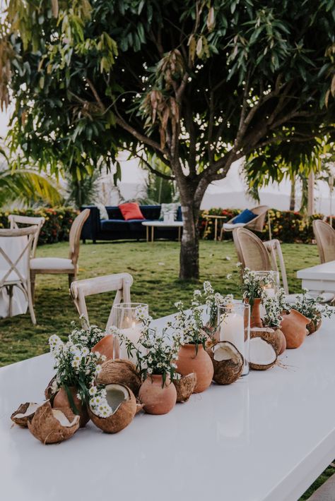 April and Soul's fabulous Destination Wedding in Costa Rica Coconut Centerpiece Wedding, Coconut Tablescape, Tropical Boho Table Decor, Coconut Centerpiece Ideas, Coconut Table Decor, Coconut Centerpiece, Terracotta Pots Wedding, African Themed Wedding, Coconut Wedding