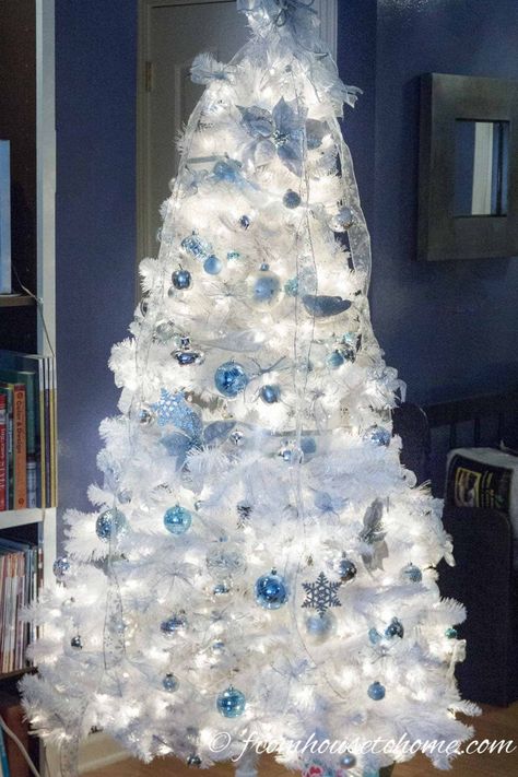 I love these elegant and glam Christmas tree ideas. With trees decorated in blue, white, pink, gold, silver, red and even black, there's all kinds of unique Christmas tree decorating ideas. #fromhousetohome #christmasdecor #christmas #christmastree  #diychristmas White And Blue Christmas Tree, Classy Christmas Tree, White And Blue Christmas, Glamorous Christmas Tree, Christmas Tree Colour Scheme, White Xmas Tree, Blue Christmas Tree Decorations, Glam Christmas Tree, Elegant Christmas Tree Decorations