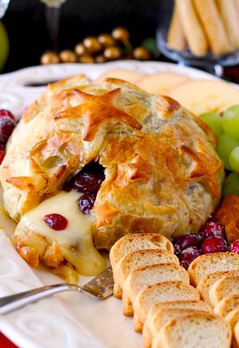 Quick, easy, luxurious and totally scrumptious. This Brie and Cranberries Baked in Puff Pastry is the perfect appetizer for the holiday season! Brie Recipes Appetizers, Baked Brie Appetizer, Baked Brie Recipes, Cranberry Baking, Brie Puff Pastry, Brie Appetizer, Cheese Puff Pastry, Brie Recipes, Lemon Blossoms