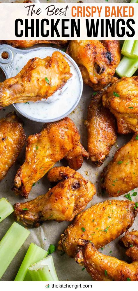 image: crispy baked chicken wings and celery sticks with ranch dressing in vintage measuring cup. Title text: The Best Crispy Baked Chicken Wings