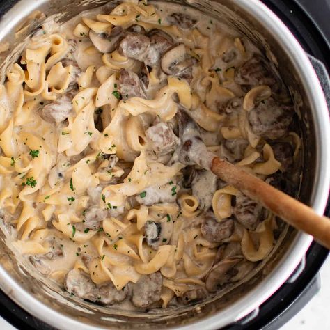 Instant Pot Beef Stroganoff is incredibly easy to make and always comes out so tender, creamy and flavorful! Fork tender bites of seared beef are cooked to perfection with mushrooms, onions, egg noodles and more in the pressure cooked in just about half an hour. Instant Pot Beef Roast With Cream Of Mushroom Soup, Instant Pot Beef Stroganoff Easy, Instant Pot Stroganoff, Instant Pot Beef Stroganoff, Beef And Noodles Instant Pot, Beef Stroganoff Instant Pot, Beef Stroganoff Pressure Cooker, Pot Roast Instant Pot Cream Of Mushroom, Instant Pot Beef Stroganoff Hamburger