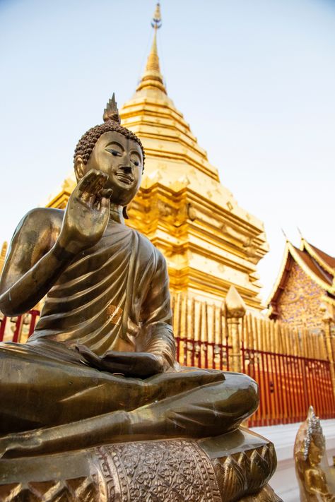 Picture features a statue of buddha outside of an impressive golden temple Thailand Tourist, Thailand Flag, Temple Thailand, Thailand Adventure, Visit Thailand, Chiang Rai, Most Beautiful Images, Buddha Sculpture, Overseas Travel