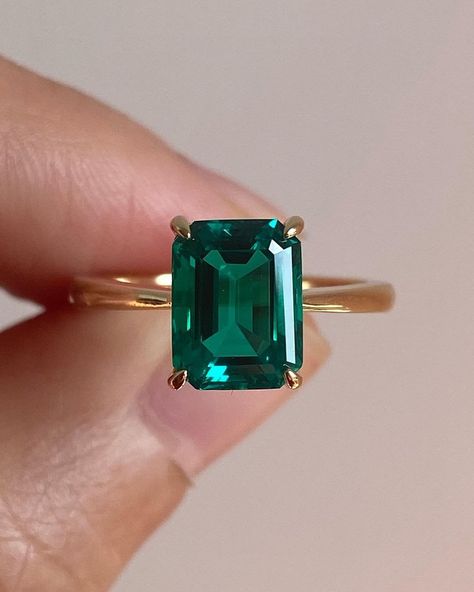 3.5CT Green Emerald Cut Moissanite Hidden Halo Set Solitaire Engagement Ring / Goldi Gifts Moissanite Jewelry Collections / 10KT Solid Yellow Gold Proposal Ring / Emerald Ring / Anniversary Gift Ring For Her / Bridal Ring / Women Ring / Moissanite Ring. SKU: SS_0035 ✥ 𝐌𝐚𝐢𝐧 𝐒𝐭𝐨𝐧𝐞 𝐃𝐞𝐭𝐚𝐢𝐥𝐬 ↣ Shape: Emerald Cut ↣ Type: Moissanite ↣ Weight: 3.58 Ct (App.) ↣ Dimension: 10x8 MM (App.) ↣ Color: Green ↣ Clarity: VVS ↣ Making Process: Handmade - Crafted by our experienced team ✥ 𝐑𝐢𝐧𝐠 𝐃𝐞𝐭𝐚𝐢𝐥𝐬 ↣ Band Width: 1.80 MM (± 0.10) [Customization Possible] ↣ Metal Purity: Solid Gold (10KT, 14KT, 18KT); Silver (925 Sterling, 935 Argentium), 950 Platinum ↣ Metal Tone: Yellow, White, Rose ↣ Stamp/Hallmark: Yes ❁❁ 𝐉𝐞𝐰𝐞𝐥𝐫𝐲 𝐂𝐞𝐫𝐭𝐢𝐟𝐢𝐜𝐚𝐭𝐞 ❁❁ ↣ Goldi Gifts branded authentica Rectangle Gemstone Ring, Rectangle Emerald Engagement Ring, Minimalist Emerald Ring, Emerald Rectangle Ring, Rectangle Emerald Ring, Engagement Ring Minimalist, Smaragd Ring, Emerald Wedding Rings, Moissanite Engagement Ring Solitaire