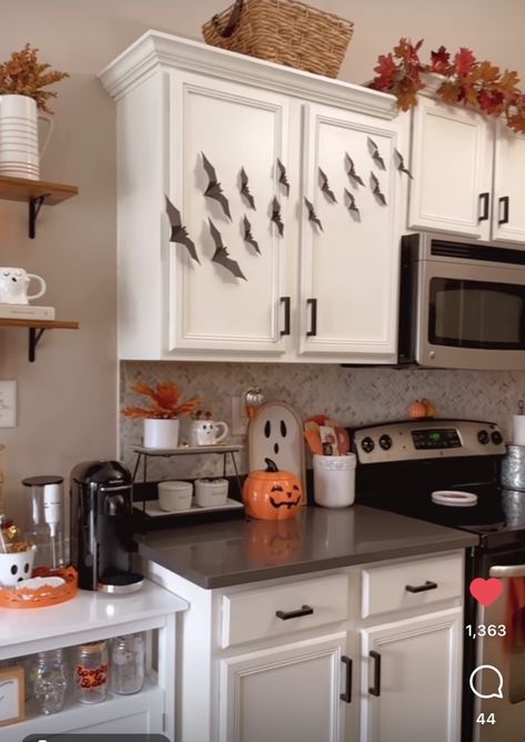 Over Cabinet Halloween Decor, October Kitchen Decor, Halloween Theme Kitchen, Makeup Vanity Fall Decor, Fall Decor Cabinets, Above Cabinet Decor Halloween, Simple Kitchen Halloween Decor, Bats On Kitchen Cabinets Halloween, Small Apartment Fall Decor Ideas