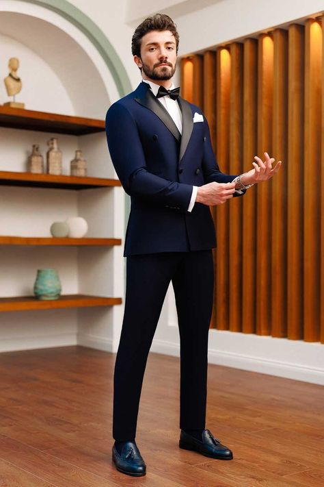 Enjoy the timeless appeal of this 2-piece navy double-breasted tuxedo suit. This suit radiates elegance and guarantees a professional and dapper appearance with its dominating 6-button blazer, peak lapels, and double vents. #tuxedo #navytuxedo #groom #navyslimfittuxedo #elegantstyle #sophisticatedlook #formalattire #refinedluxury #weddingattire Navy Blue Suit Men, Best Wedding Suits For Men, Marriage Suits, Indian Wedding Suits Men, Double Breasted Suit Men, Suit For Men Wedding, Indian Wedding Clothes For Men, Best Wedding Suits, Wedding Outfits For Groom