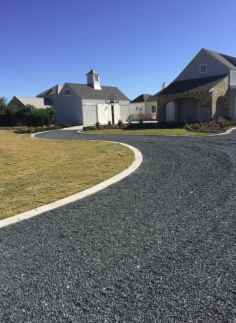 black gravel driveway Light Gravel Driveway, Dg Driveway Ideas, Black Rock Driveway, Crushed Asphalt Driveway Ideas, Rock Driveway Edging, Dark Gravel Driveway, Long Gravel Driveway Landscaping, Gravel Sidewalk Ideas, Alternative Driveway Ideas