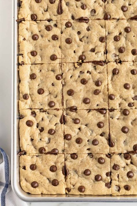 Sheet Pan Chocolate Chip Cookie Bars by The BakerMama Sheet Cake Cookie Bars, Sheet Cookie Bars, Chocolate Chip Cookie Bars Sheet Pan, Sheet Pan Bars Cookie Recipes, Sheet Pan Blondies, Chocolate Chip Pan Chewies 12 Tomatoes, Sheet Pan Chocolate Chip Cookies, Sheet Cake Desserts For A Crowd, Sheet Pan Chocolate Chip Cookie Bars