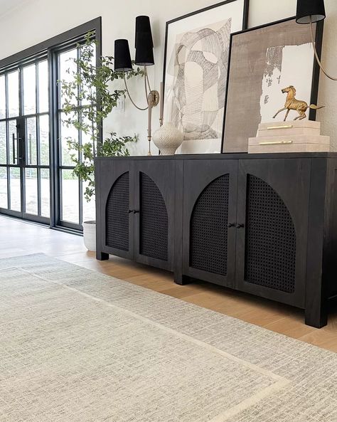 Black arch sideboard and new neutral rug in Mist/Ivory both on sale! Rug color is a very subtle blue, more of a cool toned neutral! Two Living Room Ideas, Dark Sideboard, Extra Long Sideboard, Sideboard Styling, Modern And Vintage Decor, Cane Sideboard, Credenza Decor, Moody Modern, Sideboard Styles