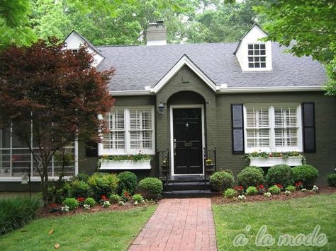 Sage Green House Black Shutters, Green Painted Brick Ranch House, Old Home Paint Colors Exterior, Painted Brick House Exterior Green, Green Painted Brick Exterior, One Story House Paint Exterior, Black Roof Green House Exterior, Green And White Exterior House, Tan Painted Brick House