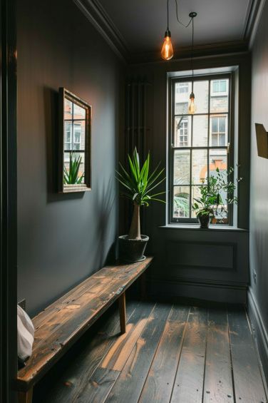 Explore elegant gray hallway ideas that transform your home's passageways into stylish and serene spaces. Painting A Hallway Ideas, Hallway Dark Paint, Black Wall Hallway, Dark Paint Hallway, Dark Painted Hallway, Hallway Ideas Dark, Black Walls Hallway, Black Hallway Ideas, Dark Hallway Paint Colors