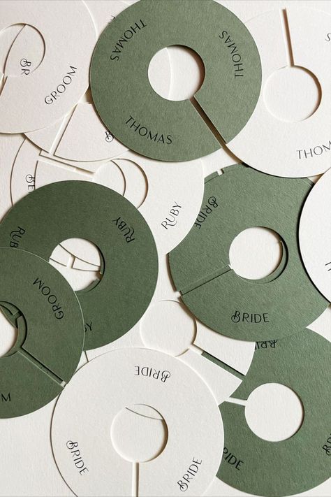 Modern Olive and cream circular wedding place names for wine glasses. Stationery designed by @notesstudiouk Party Name Tags Ideas, Wedding Name Place Ideas, Wedding Guest Name Cards, Wine Glass Name Tags, Wedding Branding Design, Name Tag Wedding, Diy Place Settings, Name Tags Wedding, Wedding Table Name