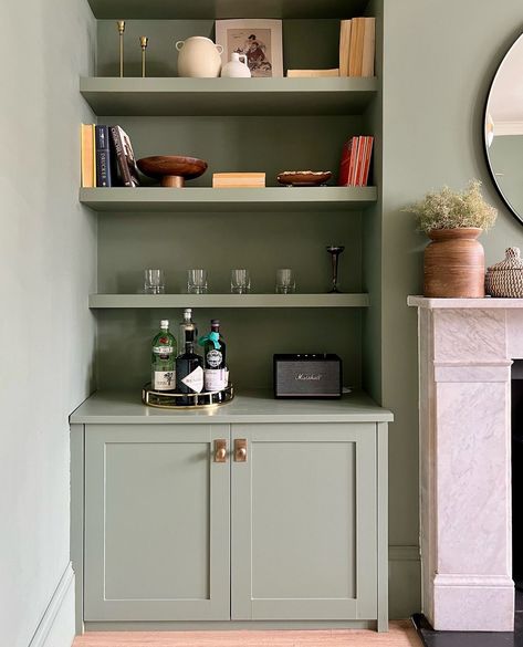 Card room green farrow   | Bit of a ‘zhuzh’ up of the alcove shelving with some old (and new) bits and pieces. I’ve also done a little hardware update by adding these… | Instagram Shaker Style Alcove Cupboards, Living Room Alcove Shelving, Alcove Drinks Cabinet Ideas, Shelving Alcove Ideas, Alcove Drinks Cabinet, Shelf In Alcove, Lounge Alcove Shelving, Green Shelves Living Room, Built In Cubby Wall